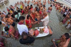 People Standing in a River during a Traditional Indian Ceremony