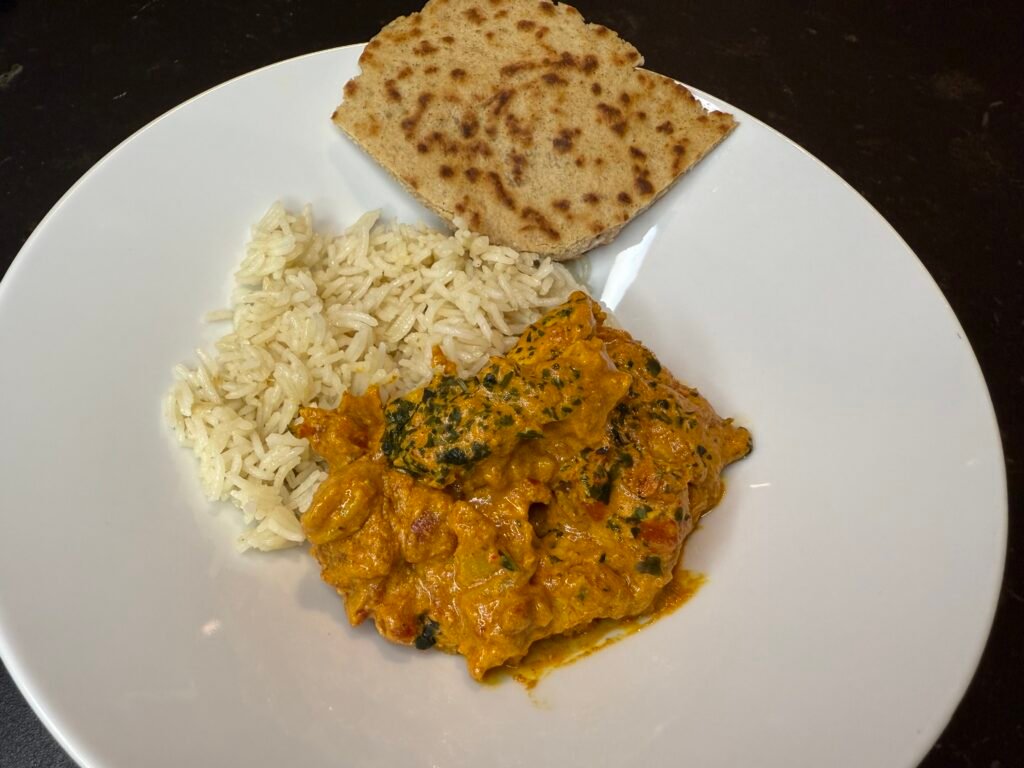 Chicken Tikka Masala, served with rice and naan